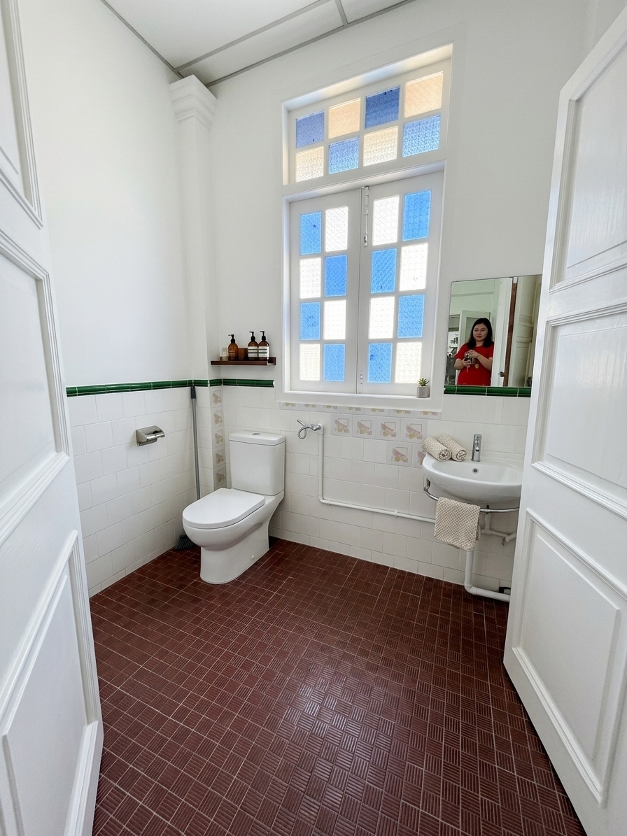 Bright bathroom with stained glass detail